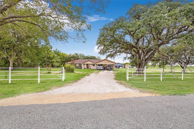 view of front of property featuring a front yard and a rural view