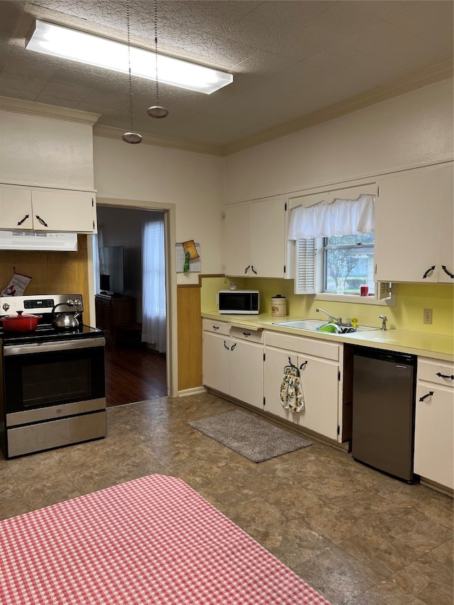 kitchen with white cabinets, appliances with stainless steel finishes, and tile floors