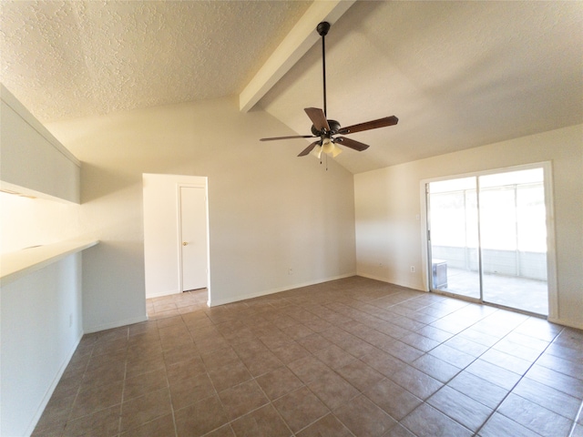 unfurnished room featuring ceiling fan, vaulted ceiling with beams, and dark tile floors