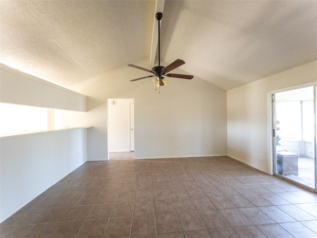 tiled empty room with ceiling fan, lofted ceiling, and a textured ceiling