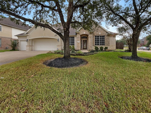 view of front of property featuring a garage and a front lawn