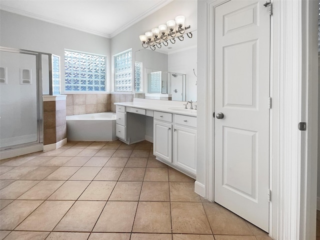 bathroom featuring vanity, ornamental molding, tile patterned floors, and independent shower and bath