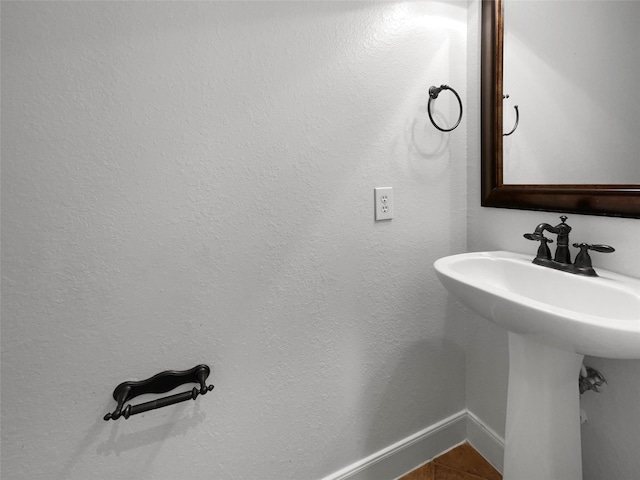 bathroom featuring sink and tile patterned flooring