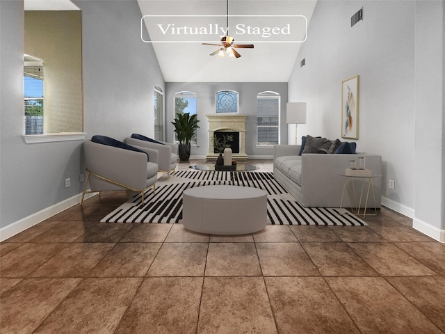 living room featuring tile patterned flooring, ceiling fan, and high vaulted ceiling