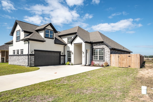 french country inspired facade featuring a front lawn and a garage