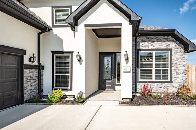 entrance to property featuring a garage