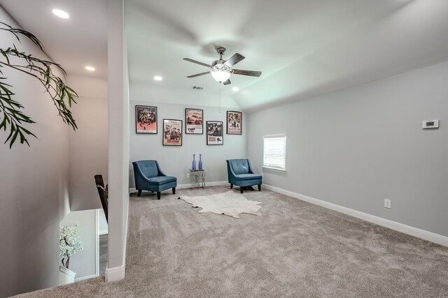 unfurnished room featuring light colored carpet, ceiling fan, and lofted ceiling