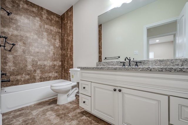 full bathroom featuring tiled shower / bath combo, toilet, tile floors, and vanity with extensive cabinet space