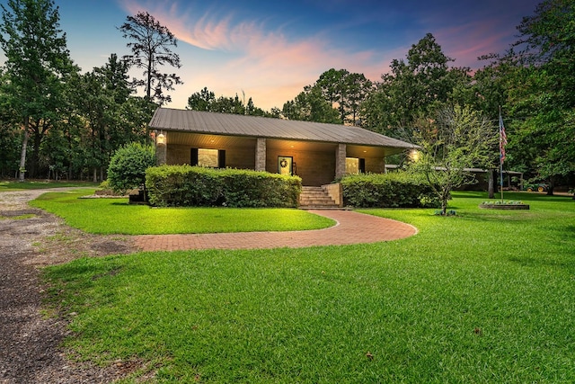 view of front of house with a yard