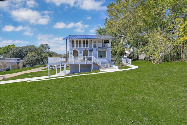 view of front of property with a front lawn and a balcony