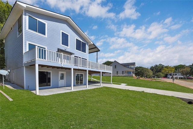 rear view of house with a lawn