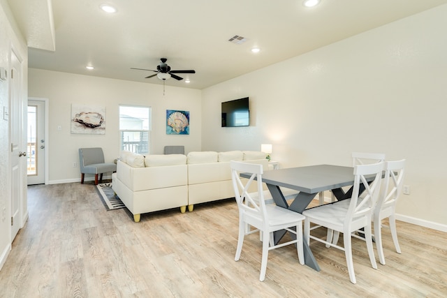 dining space featuring light hardwood / wood-style floors and ceiling fan