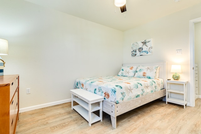 bedroom featuring ceiling fan and light wood-type flooring