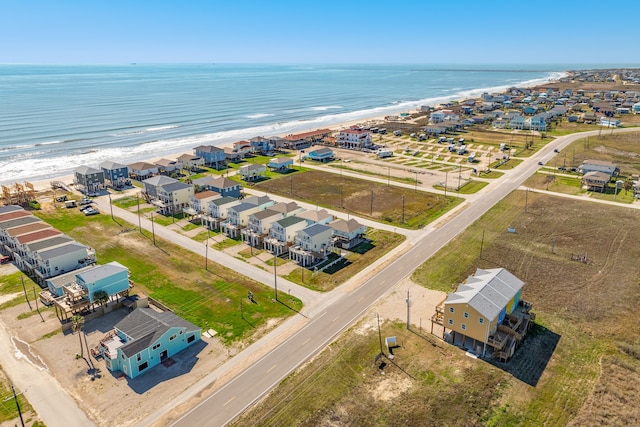 bird's eye view featuring a water view and a view of the beach