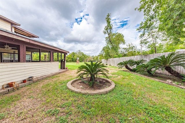 view of yard featuring ceiling fan