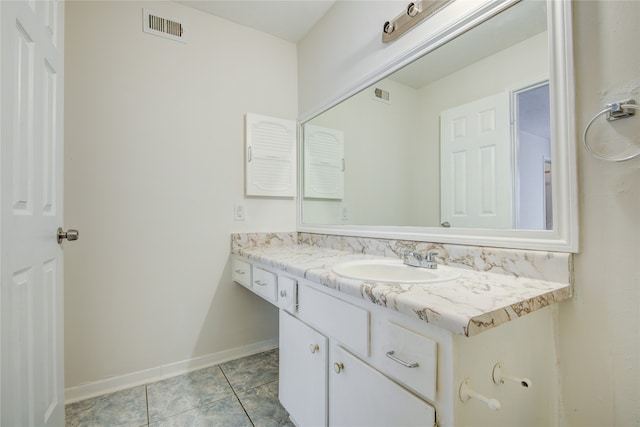 bathroom featuring large vanity and tile floors