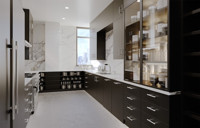 kitchen with high quality appliances, tasteful backsplash, and sink