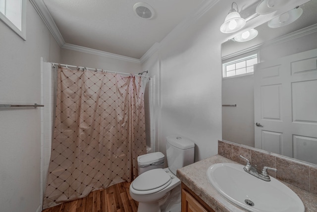 bathroom with vanity, toilet, hardwood / wood-style flooring, and ornamental molding