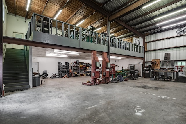 garage with a workshop area and metal wall