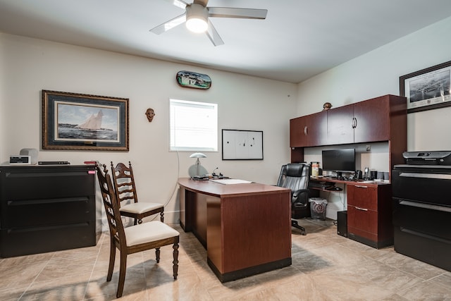 tiled office featuring ceiling fan