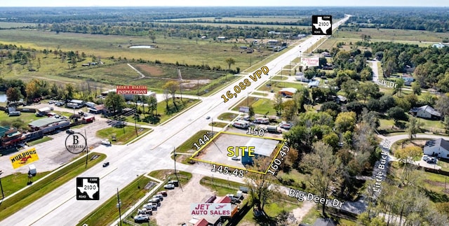 birds eye view of property featuring a rural view