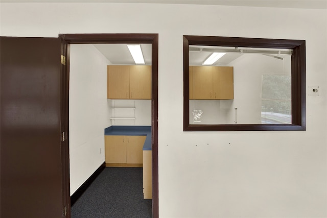 corridor featuring baseboards