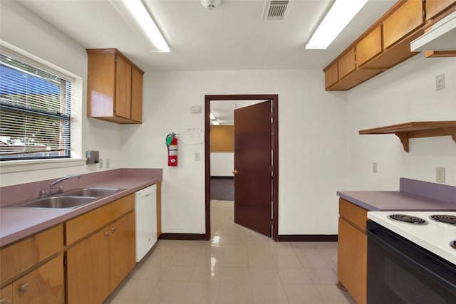 kitchen featuring sink and white appliances