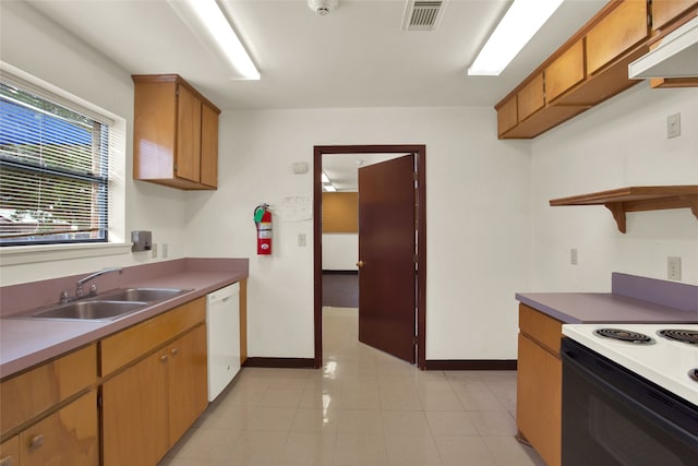 kitchen with white dishwasher, a sink, range with electric cooktop, baseboards, and visible vents
