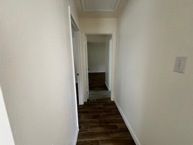 corridor featuring dark wood-type flooring