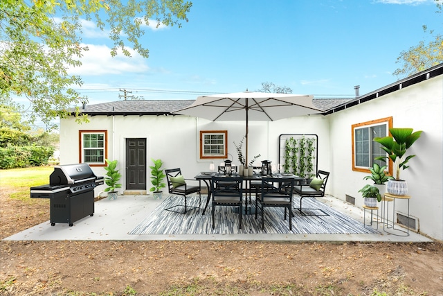 back of property featuring a patio area