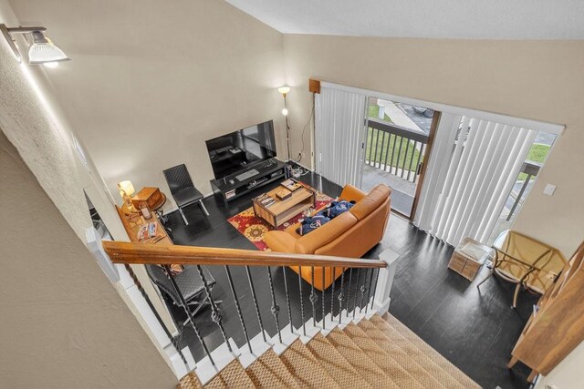 interior space featuring a wealth of natural light, high vaulted ceiling, and hardwood / wood-style flooring