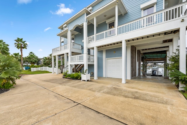 view of property exterior featuring a carport and a garage