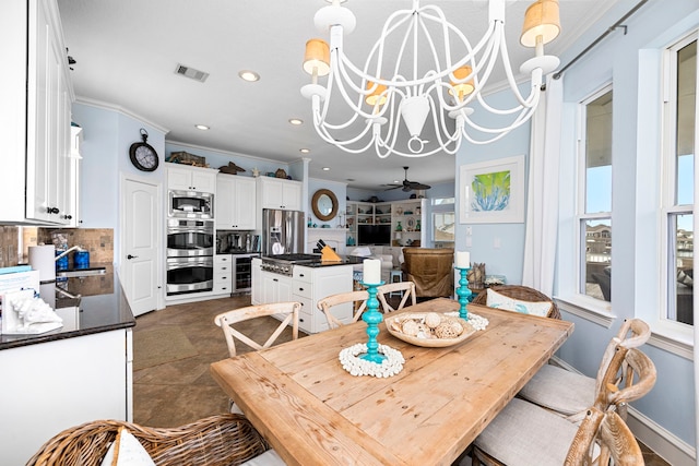 dining area with ornamental molding, ceiling fan with notable chandelier, a wealth of natural light, and wine cooler