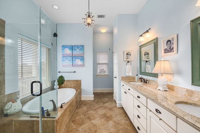 bathroom featuring vanity, a notable chandelier, and independent shower and bath