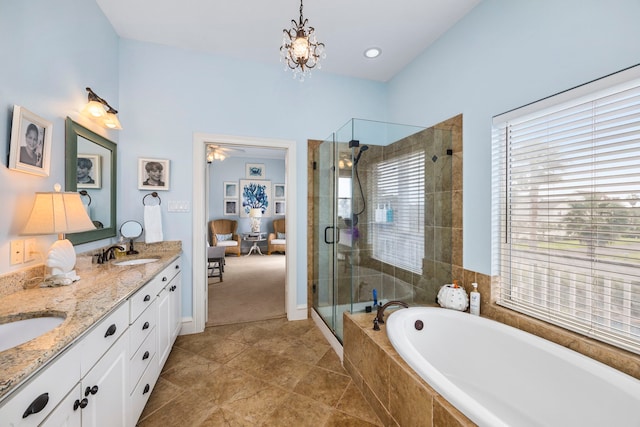 bathroom featuring vanity, separate shower and tub, tile patterned floors, and a chandelier