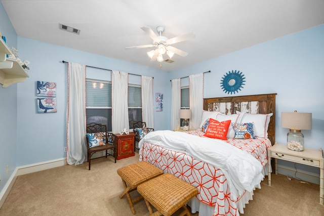 bedroom with ceiling fan and carpet floors