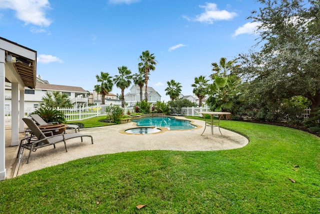 view of swimming pool featuring a patio, an in ground hot tub, and a lawn