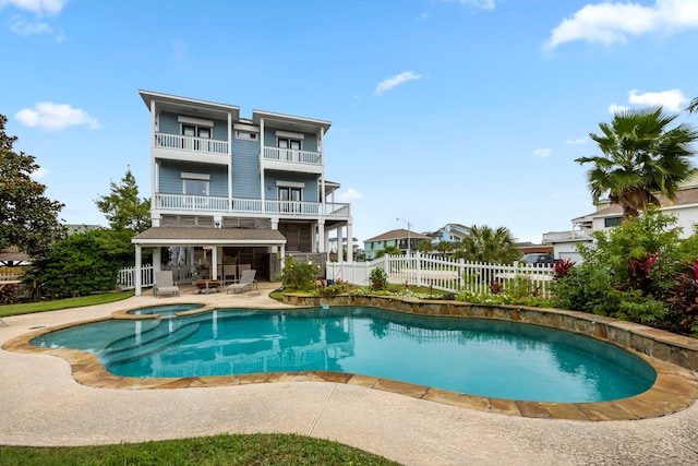 view of pool featuring an in ground hot tub and a patio