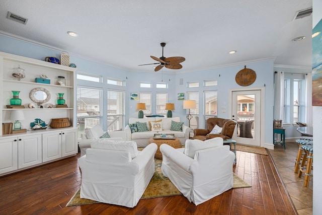 living room featuring ceiling fan, ornamental molding, and dark hardwood / wood-style floors