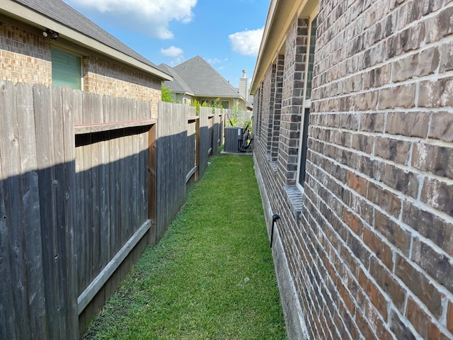 view of yard featuring central AC unit