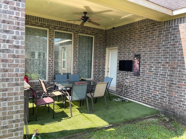 view of patio / terrace featuring ceiling fan