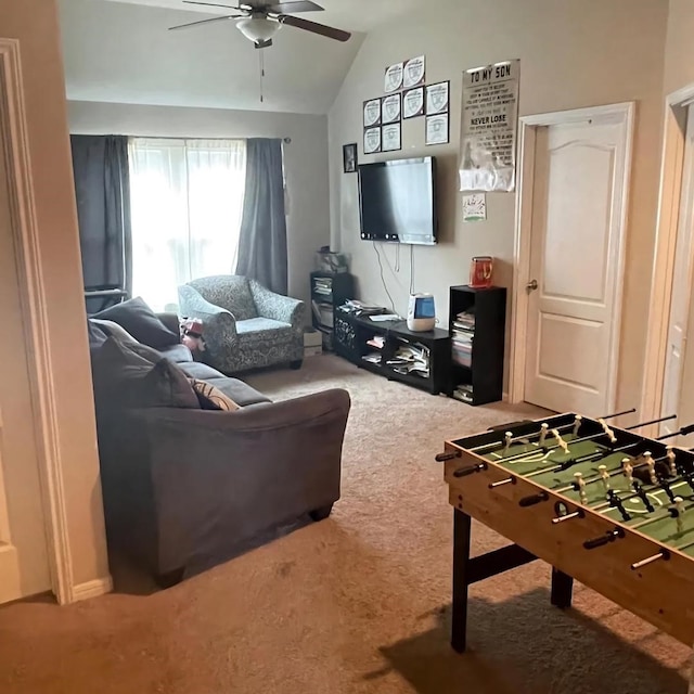 living room featuring lofted ceiling, ceiling fan, and carpet flooring