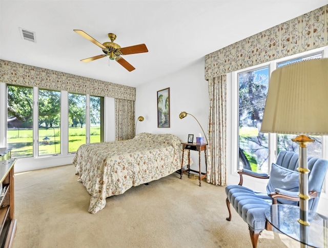 carpeted bedroom featuring ceiling fan