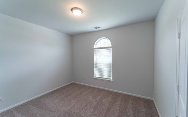 view of carpeted spare room