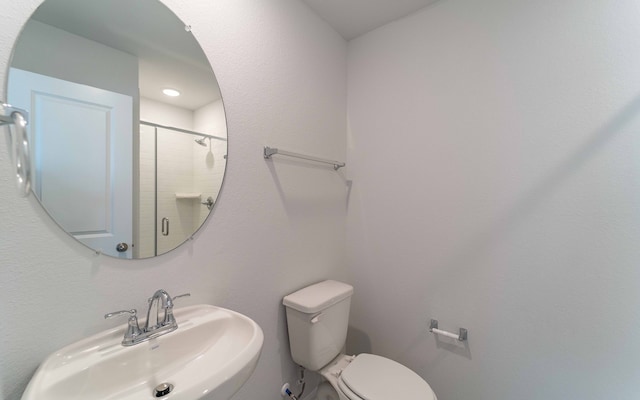 bathroom featuring sink and toilet