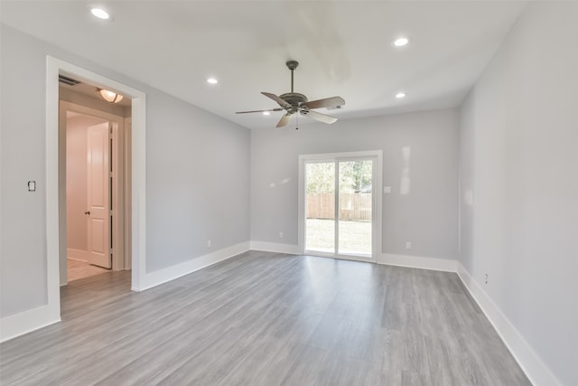 empty room with light hardwood / wood-style floors and ceiling fan