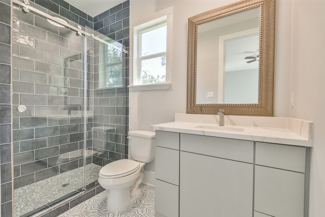 bathroom with a shower with door, tile patterned floors, vanity, and toilet