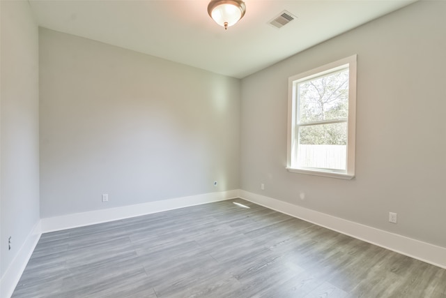 unfurnished room featuring hardwood / wood-style floors