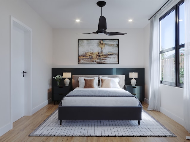 bedroom with ceiling fan and light wood-type flooring