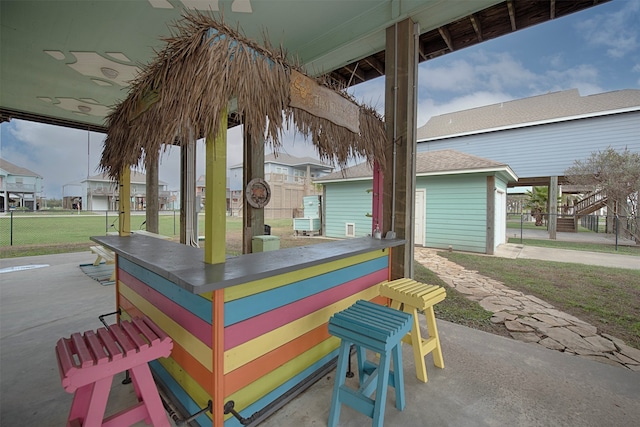 view of terrace featuring an outdoor bar